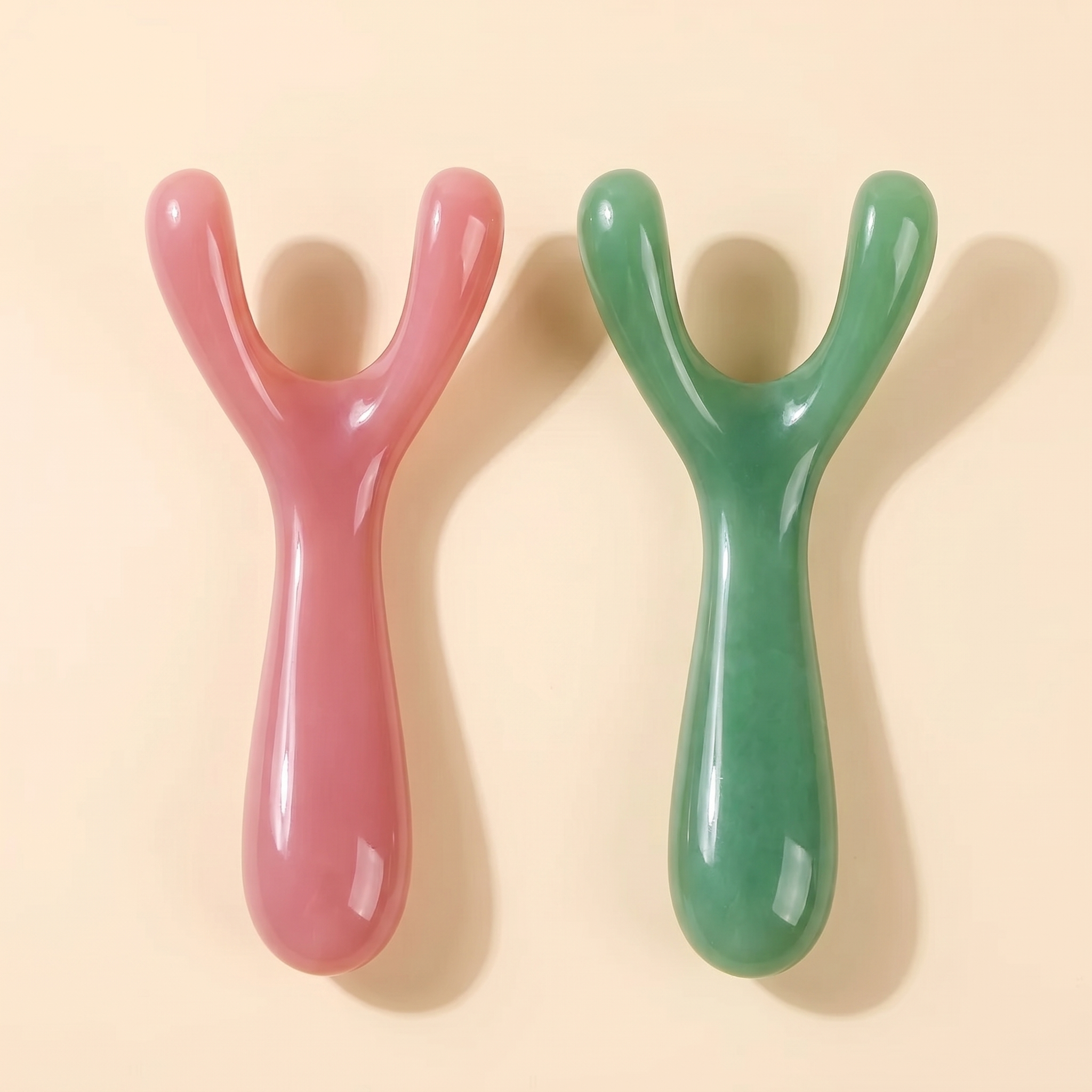 Velé Y-shape resin gua sha face massager, pink and green